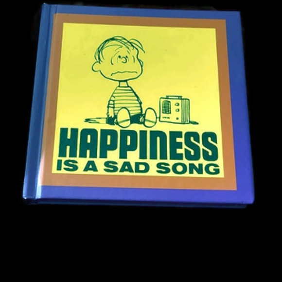 Peanuts happiness is a sad song book.